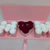 Pink gift box with white and red roses arranged in compartments