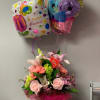 Soft pink roses, fragrant lilies, and cheerful gerbera daisies come together in