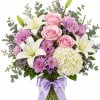 A soft and elegant arrangement featuring blush pink roses, fragrant white lilies