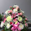 A lush, rounded bouquet of pink and white blooms that reads as