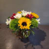 Sunflowers accented with trick dianthus, anenomes, hypericum berries and locally grown daffodils.

Measures