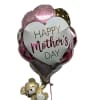 A glossy heart-shaped foil balloon printed with "Happy Mother's Day" sets a