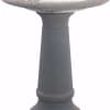 Gray stone birdbath pedestal on a white background