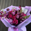 A vibrant and romantic fuchsia-pink flower bouquet designed to express passion, joy