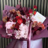 An elegant and romantic flower bouquet blending soft blush pink hydrangeas with