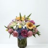A lively, pastel-packed flower arrangement perfect for a birthday bouquet or cheerful
