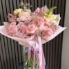A soft and elegant bouquet featuring a delicate blend of blush pink