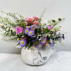 Soft pink roses lead this airy Mother's Day or everyday bouquet, a