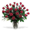 Two dozen red roses in a classic large glass vase is twice