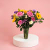 Bright sunflowers and hot pink gerbera daisies make a bold first impression
