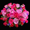 Bouquet of pink and red roses with a pink ribbon bow