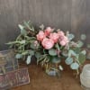 A lovely arrangement of  6 rose filler fashion with feather eucalyptus