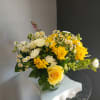 This beautiful flower arrangement of fresh mixed seasonal blooms is made by