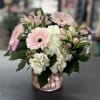 Pale pink gerberas, white hydrangeas, soft alstroemeria and asters arranged in a