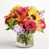 Like a warm embrace, this vibrant flower bouquet delivers your sentiments to