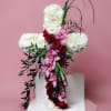 Cross of mums with incredible spray of orchids or other flowers. 