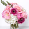 Pink and white mixed bouquet in a clear glass vase