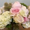 Bouquet of pale pink roses and cream hydrangeas