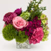 A richly layered arrangement of soft pinks, vibrant berry tones, and fresh