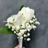 White tulips and alstroemerias with  baby's breath and green leaves, compactly