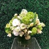 A Luscious spring arrangement in shades of tart lime green and lush