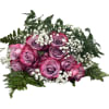 Pink and lavender roses with white baby's breath and fern foliage