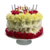 Tiered cake made of red, white, and yellow flowers with birthday candles