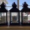 Three memorial lanterns with sentimental text and floral designs
