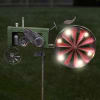 This solar spinner does double duty by spinning in the breeze and