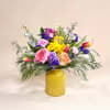 A joyful, garden-style arrangement bursting with vibrant color perfect for Mother's day.