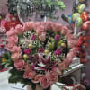 "A masterpiece of elegance and whimsical charm."

This stunning arrangement is a true