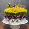 Yellow, purple, white and green chrysanthemums and daisies arranged like a cheerful