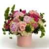 An abundant mix of peonies and fresh blooms in layered pink hues