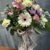 Soft pastel mix of gerbera, roses, carnations and blooms beautifully arranged in