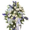 Soft blue hydrangeas and bright delphinium create a calming wash of color