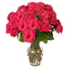 Arrangement of bright pink roses in a clear glass vase
