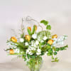 A fresh and airy arrangement in soft whites and vibrant greens, accented