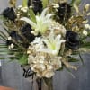 White lilies, black roses and cream gold hydrangeas with metallic gold foliage
