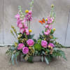 Designer's choice of seasonal cut flowers and accents to include bright and