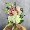 Featuring classic roses, a full hydrangea, and elegant snapdragons, "Mama Mia" blends