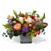 Bright colors of spring garden blooms arranged in a large and heavy