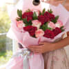 A charming and romantic bouquet featuring 12 beautiful red and pink roses