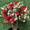 Send out a dozen of premium roses with lilies. This large arrangement