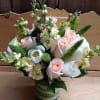 A sweet collection of pastel pink roses, stock, white tulips, snap dragon