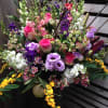 This large arrangement comes complete with lisianthus, stock, alstroemeria, lilies, snap dragons