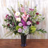 A tall, garden-style Mother's Day or birthday arrangement that feels like a
