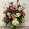 Tall, airy mix of pink and cream gerbera, roses, hydrangea &amp; alstroemeria