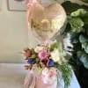 This floral arrangement is the perfect gift for Mom. It features a