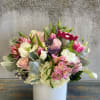 This angelic arrangement is as cute as it is pretty. Featuring the