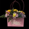 Fresh blooms artfully arranged in an adorable pocketbook. 

Due to disruptions in